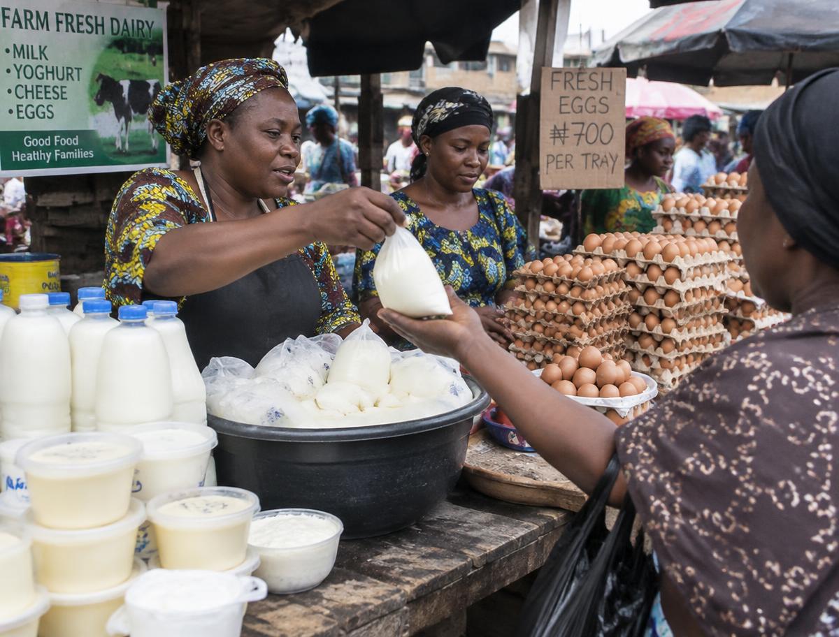 Women traders selling dairy and eggs at a local market.